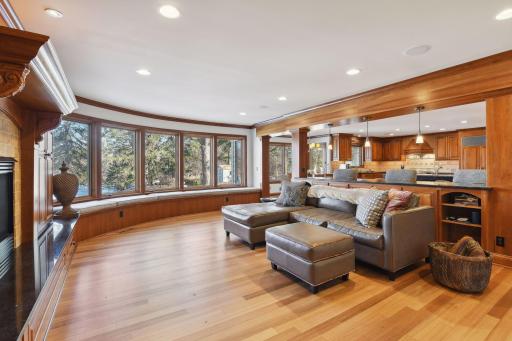 A wall of windows overlooking a serene and tranquil backyard