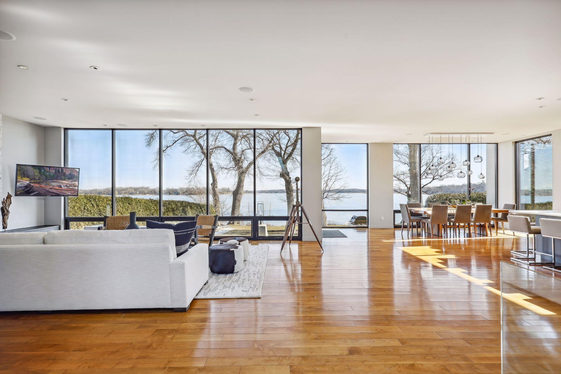 Open floor plan with windows all focusing on the lakeshore