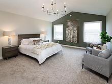 Owner's bedroom with vaulted ceiling and ample space
