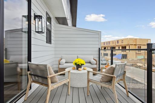 Spacious deck that allows for both casual seating plus dining!