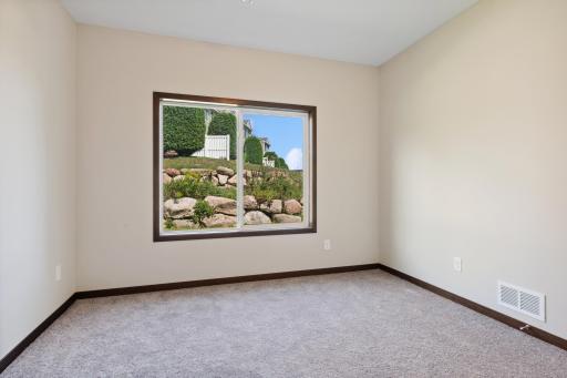 MODEL PHOTO (4928 White trim): Large bedroom 3 of 3! upgraded carpet and large closet.