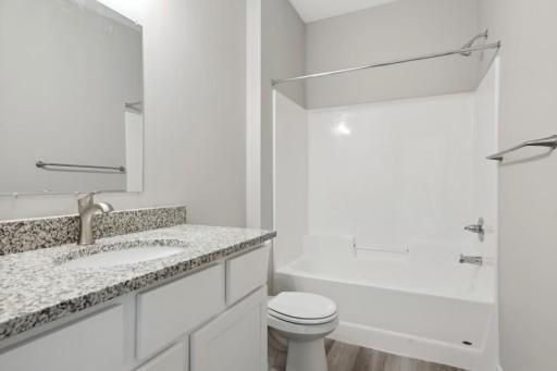 4928 offers white Cabs like this model pic of main, full bathroom with soft close cabs and luxury wide planked floor!