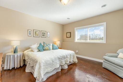 Secondary suite in the lower level complete with it's very own custom bathroom.