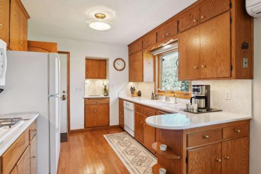Beautiful, mid century cabinetry with new hardware, quartz counter, new sink and faucet