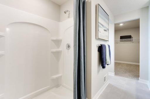 Primary bathroom with huge shower and lots of storage.