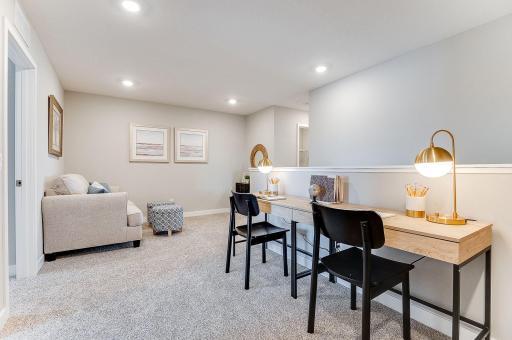 Once upstairs, the entire level flows from the focal point of this loft space. Sure to become a family favorite hangout spot, the room is centrally located from each of the home's upper level bedrooms! Photo of model home, color & options will vary.