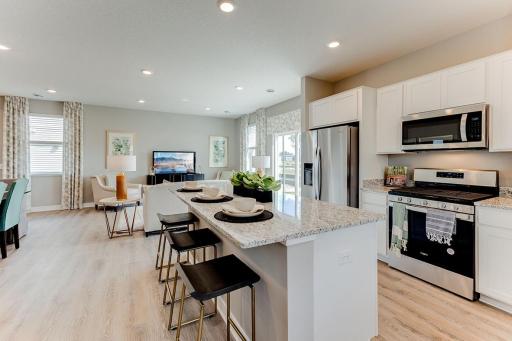 Open and inviting throughout, the stunning kitchen will be the focal point of gatherings for years to come. *Pictures are of model, actual colors in home may vary.