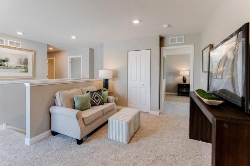 Located on the upper level, this perfectly sized living space has enough room for a desk, television, and seating. Plus, it is just steps away from all four bedrooms. *Pictures are of model, actual colors in home may vary.