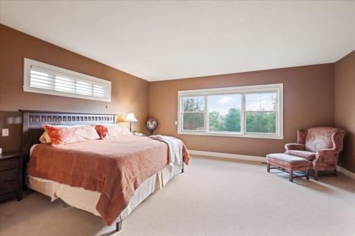 The main level features the primary suite that boasts a massive walk-in closet and private bath