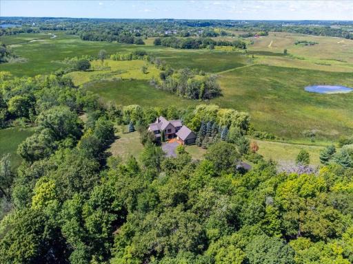 Embedded in nature, the property features 23+ acres of walking trails, mature hardwoods, naturally restored prairie land, abundant wildlife and views worthy of paintings.