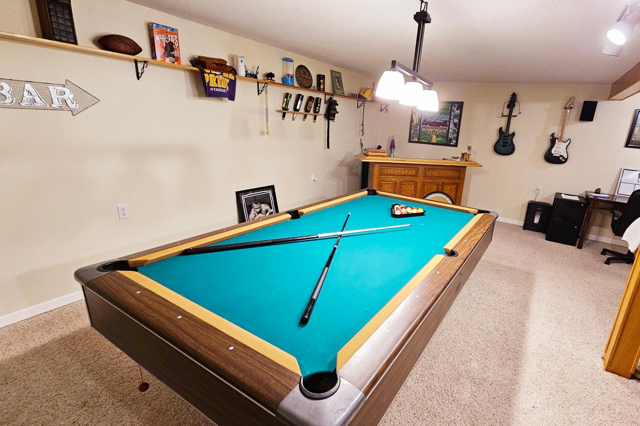 pool table with accessories stay