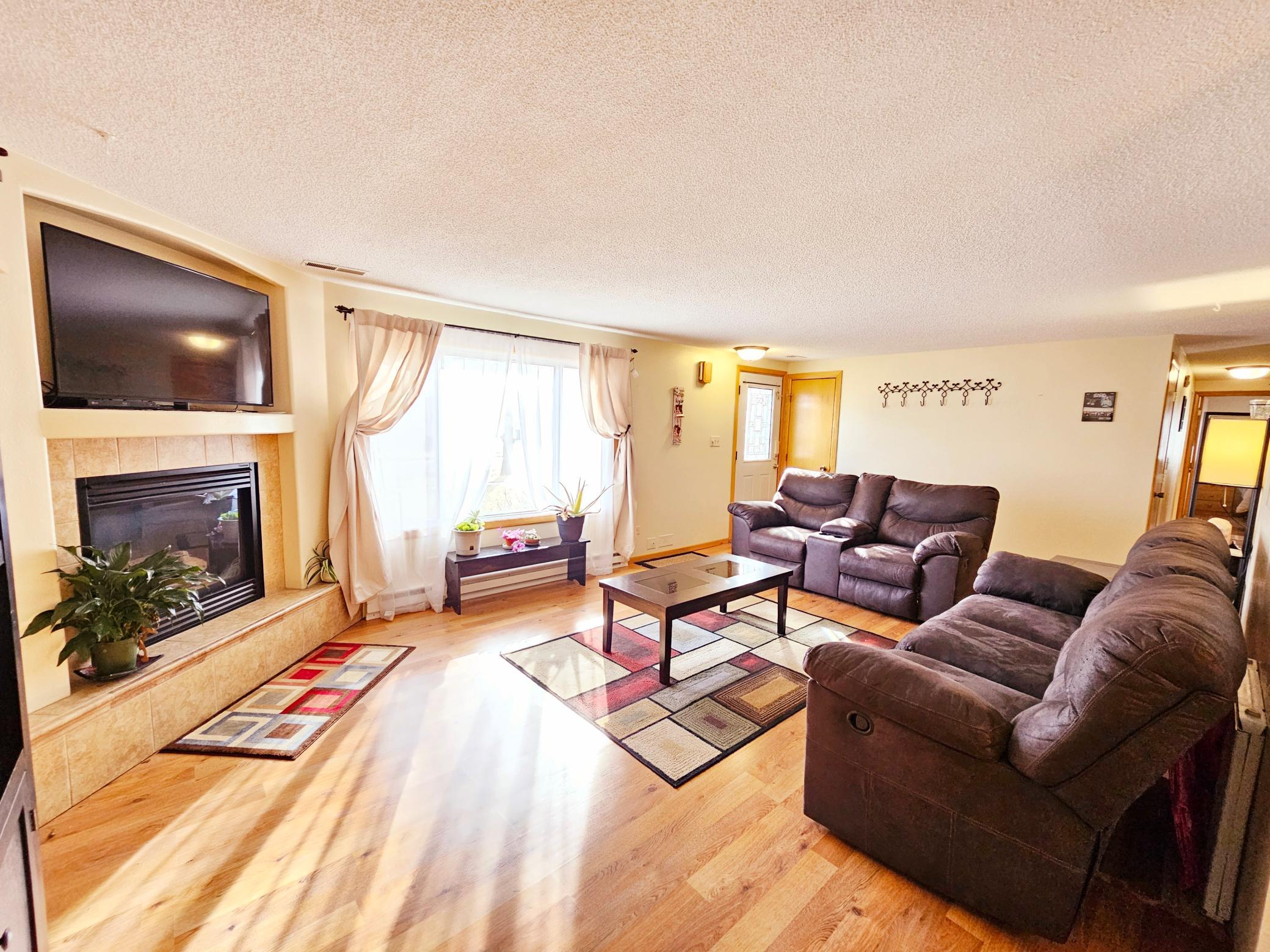 Warm, cozy fireplace, lots of natural light