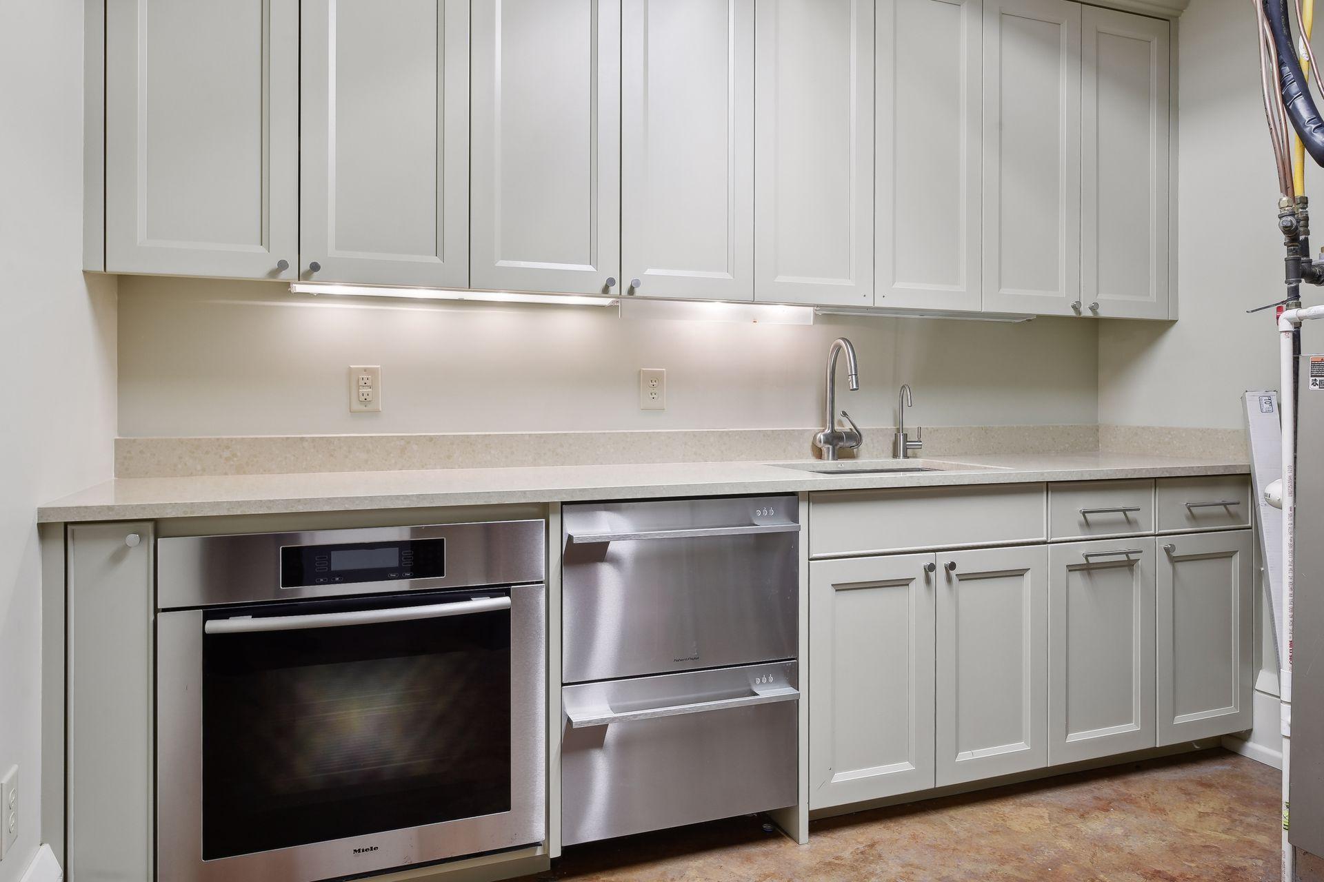 Catering area off full bar area in lower level, full fridge