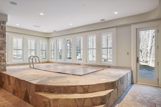 Lap pool with walk out to woods and 1/2 bath