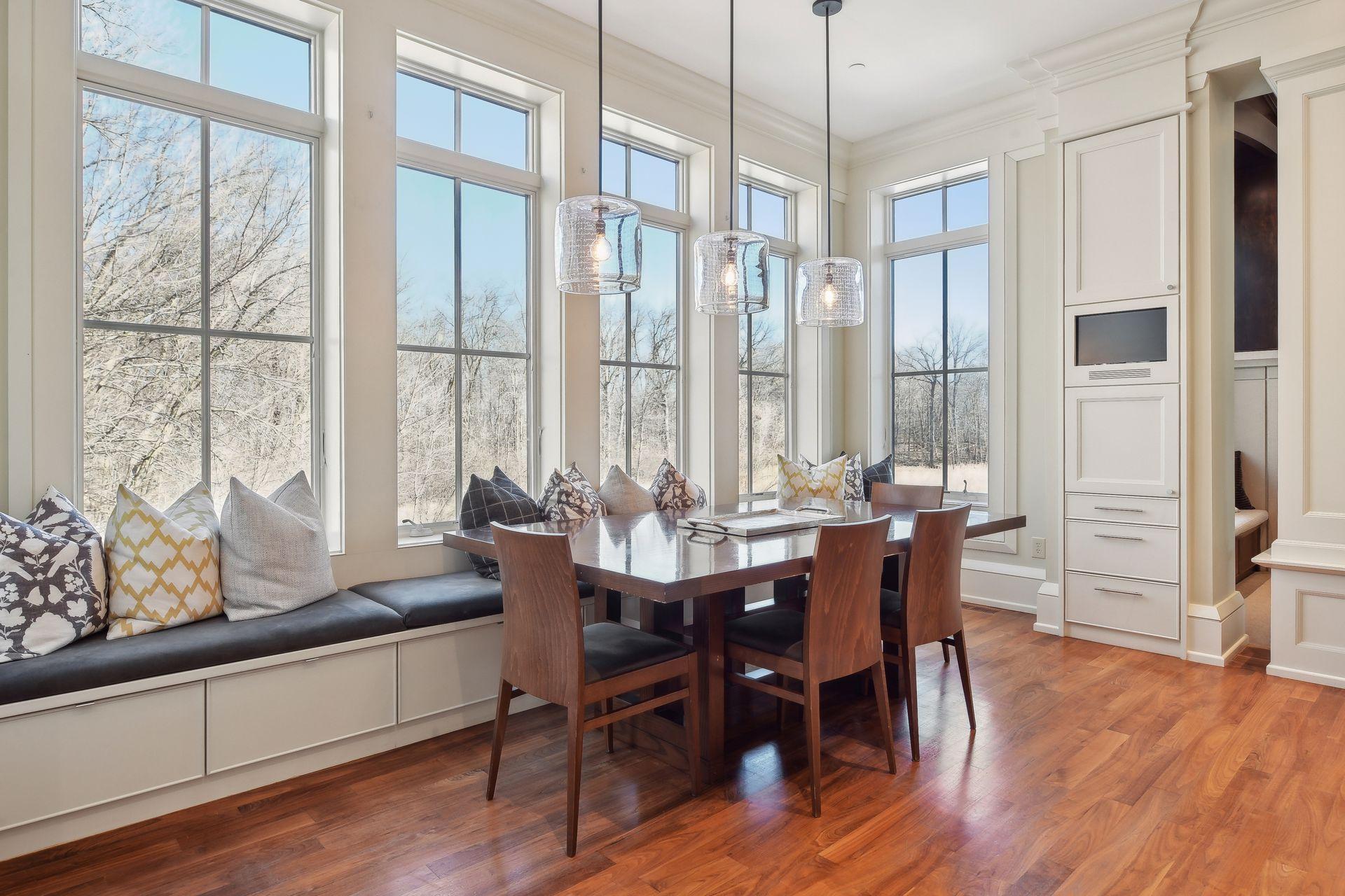Wall of windows with tv for breakfast area