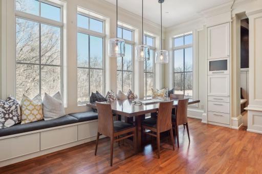 Wall of windows with tv for breakfast area