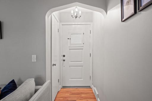 Inviting entry leads you into the living room. Notice the arch detail and lighting.
