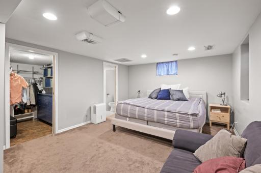 This spacious bedroom is in the lower level and offers a huge walk-in closet for your convenience.