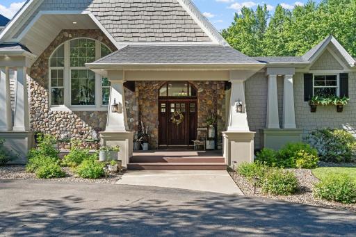 Welcoming front porch w/ swing & sitting area