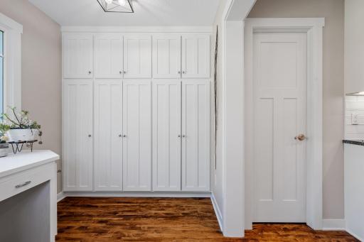 Full height cabinets for additional storage. Walk-in storage pantry w/ automatic light (door on the right)