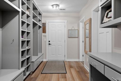 Mud Room features enameled built-in lockers features cubbies, benches and closed storage and access to and from the garage