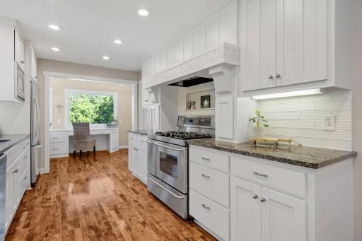Granite tops w/ subway tile backsplash and stone mosaic accents