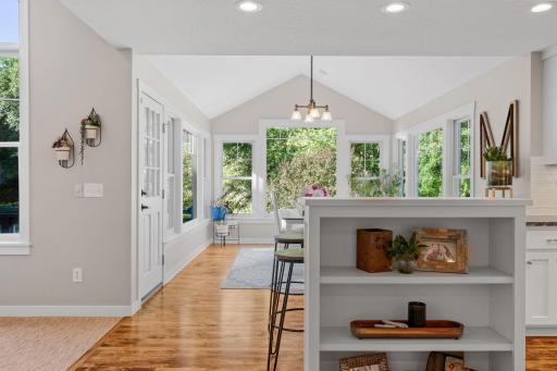Dining Room offers full glass door that opens to the maintenance free deck and lower patio as well as open to the kitchen
