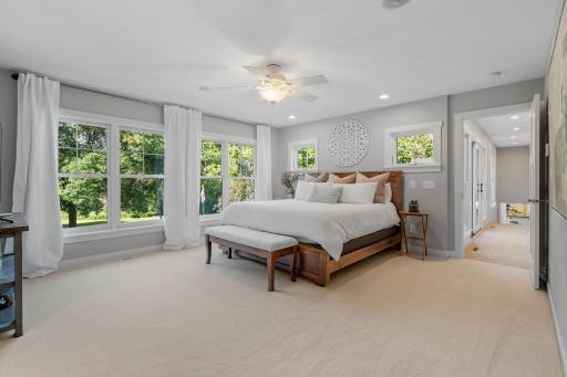 Expansive windows w/ property & creek views