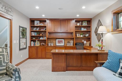 Office features built-in cherry desk & credenza w/ tons of storage w/ pocket door access