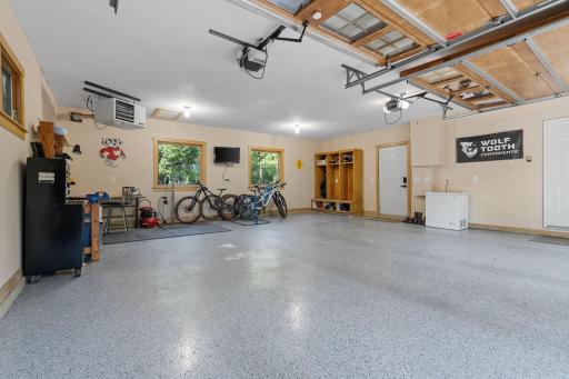 Oversized 2-car stall heated garage w/ epoxied floors