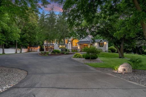 Large circular driveway with additional parking and basketball court (on the left, not pictured)