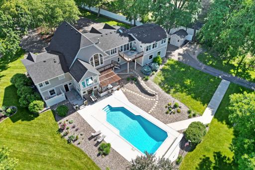 Close in acreage property w/ modern upgrades throughout. Enjoy outdoor living w/ an inground pool, volleyball court, patios, decks, porches, meandering creek, biking/hiking trails, pond, and all set among mature trees for the ultimate privacy!