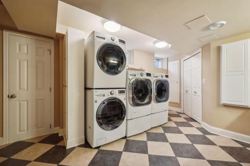 Well designed laundry room with double washer and dryer units.