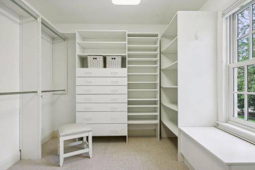 Private dressing closet with customized shelving.