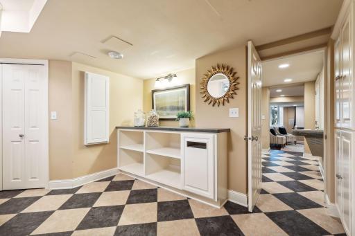 Don't miss the built-in ironing board, folding counter, laundry basket racks and trash can! Laundry schute, too!