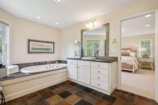 Spa-like bath with dual vanities, jetted tub, steam shower, heated floors and towel warmer!