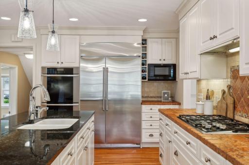 New 48" built-in Cafe refrigerator, double Miele ovens and dishwasher, and Wolf gas cooktop!