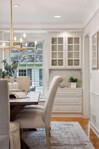 Showcase shelving and drawers designed to keep the architectural integrity of the home.