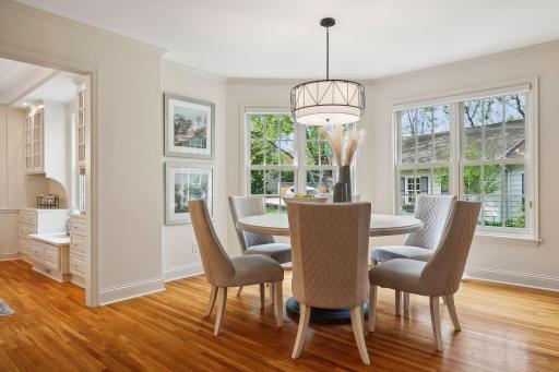 Coved dinette space off of the kitchen overlooks the rear yard.