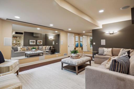 With the push of a button, the screen goes up and the family room space turns into a dance/yoga studio complete with professionally installed spring floor.