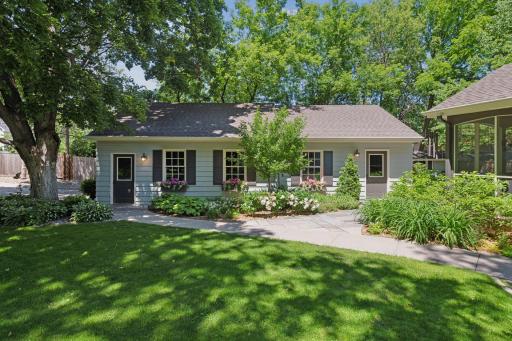 Rare heated 4-car garage with newer concrete driveway + shed!