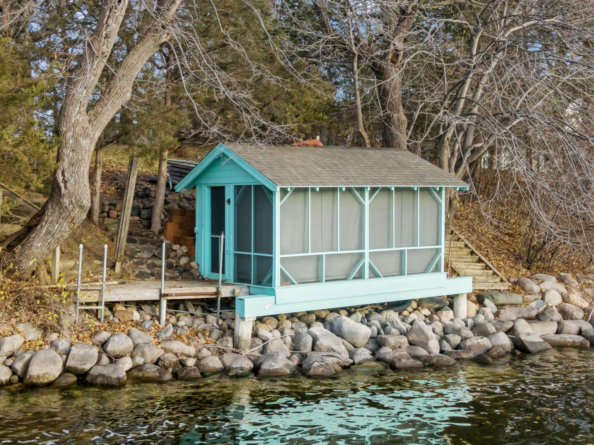 Charming boat house at water’s edge