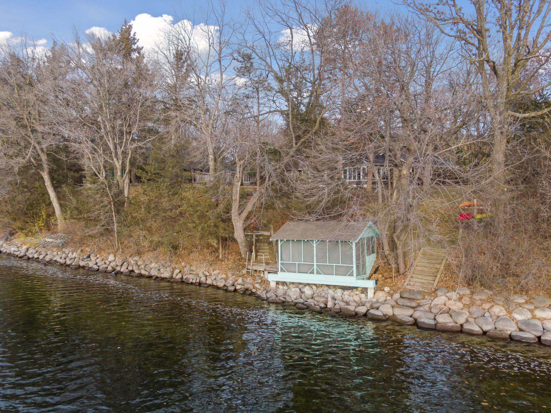 Charming boat house at water’s edge