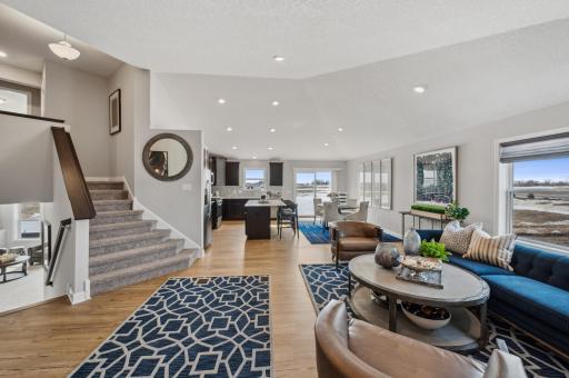 Welcome to the Foster! This open concept floorplan allows for optimal versatility and comfort. Actual homes cabinets will be white. (Photo of a decorated model, actual homes finishes will vary)