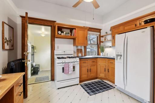 Updated kitchen is bright and airy with 2 windows and direct access to the back porch.