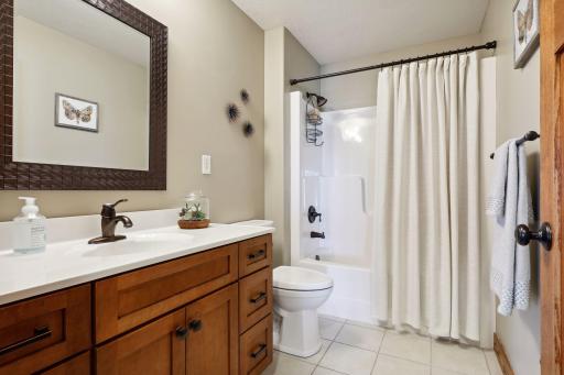 Second full bath on the main--stylishly updated with tile flooring. It has barely been used!
