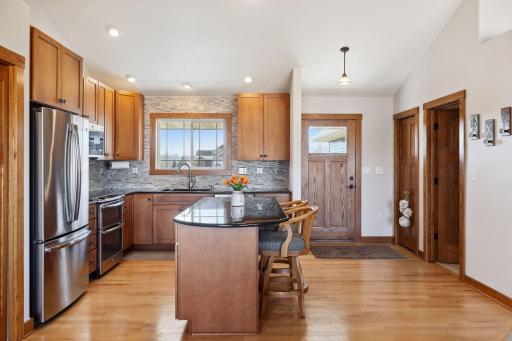 Warm refinished floors throughout kitchen and dining areas
