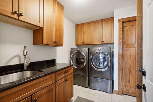You might even enjoy doing laundry in this beautiful laundry room!!