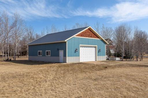 Custom built 36x48 outbuilding/shop is insulated, heated and has running water