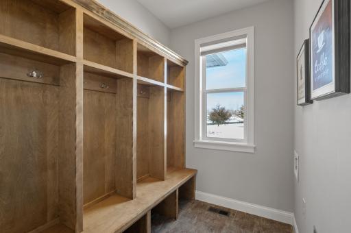 Mudroom with plenty of storage & has a washer & dryer hookup!
